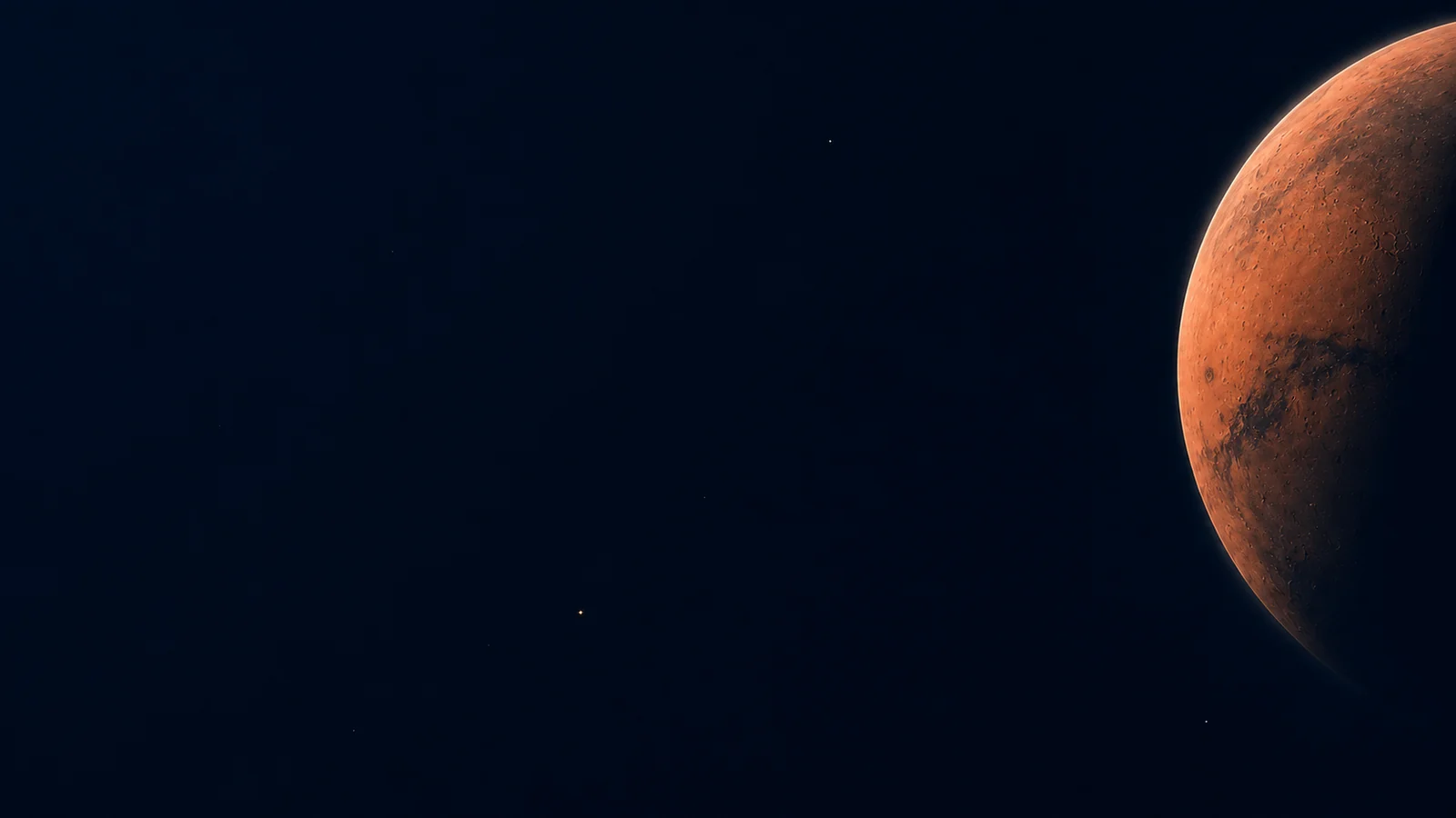 Superficie rojiza de Marte parcialmente visible sobre el cielo oscuro